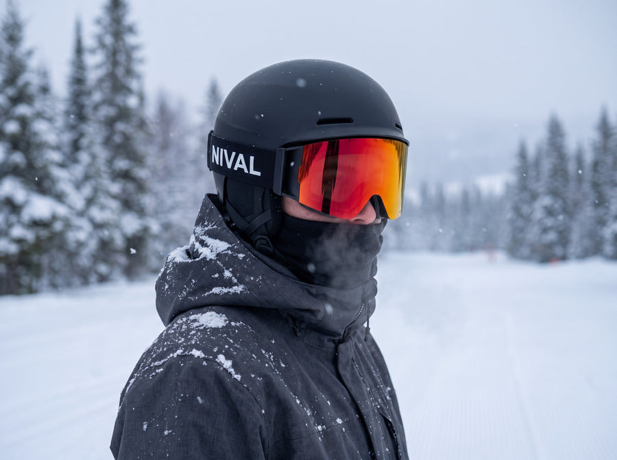 Snowboarder with gaiter up and NIVAL goggles clear on a cold morning